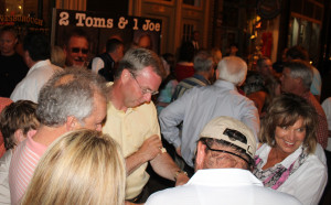 Washington County Mayor Dan Eldridge, center, checks early election numbers on Main Street in Jonesborough. (Photo by Jeff Keeling)