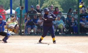 A three-run homer comes off the bat of University High's Kutu Hall in the seventh inning. (Photo by Mike Higginbotham)