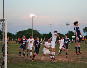 Topper senior Max Vaughn heads a ball out of Science Hill's box in the team's 4-1 victory over Cookeville. (Photo by Bill Flere)