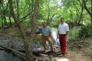 Bill Francisco, left, and Lowe's of Jonesborough Manager Chris Meadows at a Sinking Creek crossing where Lowe's plans to fund and construct one of three bridges at the wetland.