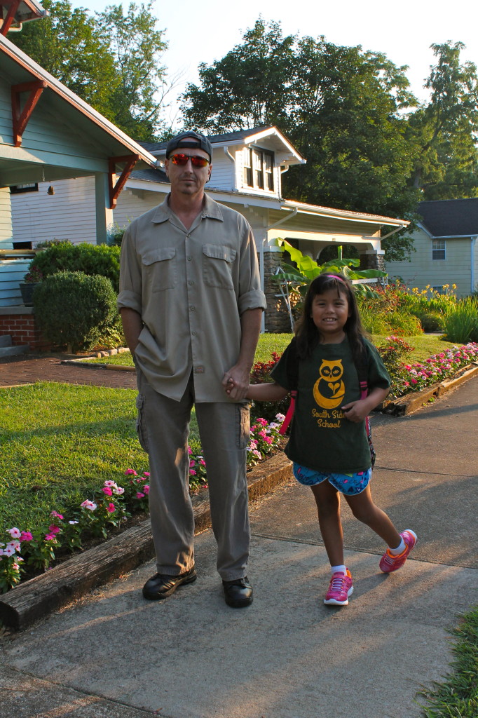 Angelina Nelson heads to her first day of second grade with dad Les.