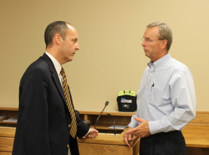 New commissioner Joe Wise, left, discusses the budget with Mayor Dan Eldridge during a break in Monday's budget hearing.