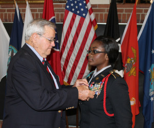Legion of Valor member Col. Thomas Reeves (Ret.) presents Stephanie Alu with the Bronze Cross. (Photo by Jeff Keeling)