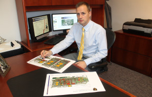 ETSU Chief of Staff Jeremy Ross with the university's proposed master plan, which shows an off-campus performing arts center. (Photo by Jeff Keeling)