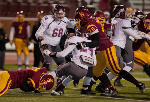 Topper DE Chase Silvers and DL Quintin Alibocus team up to tackle DB RB King Russell