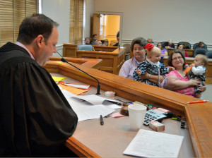 Chancellor John Rambo rules in favor of the adoption of Samantha and Peyton by Stephanie Ledford. Shown at right is Ledford's babysitter, Christina Ward. (Photo by Scott Robertson)