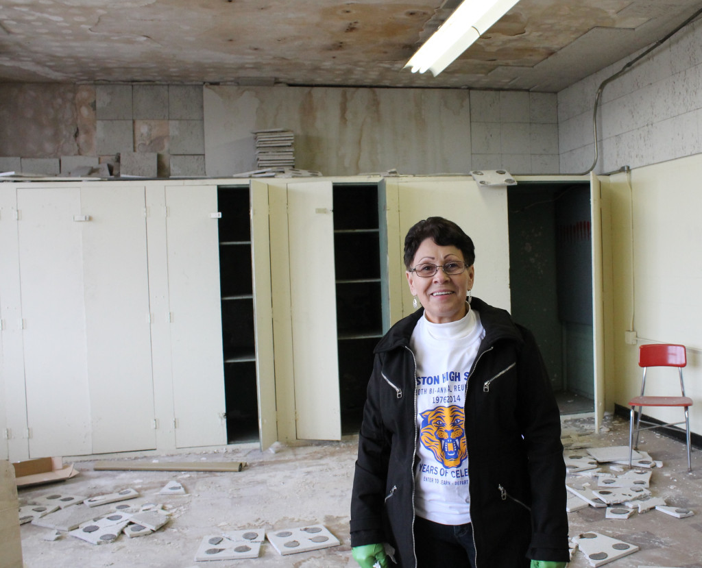 Former Langston High drum major Evelyn Debro in the school's old band room, where roof leaks have caused additional damage.