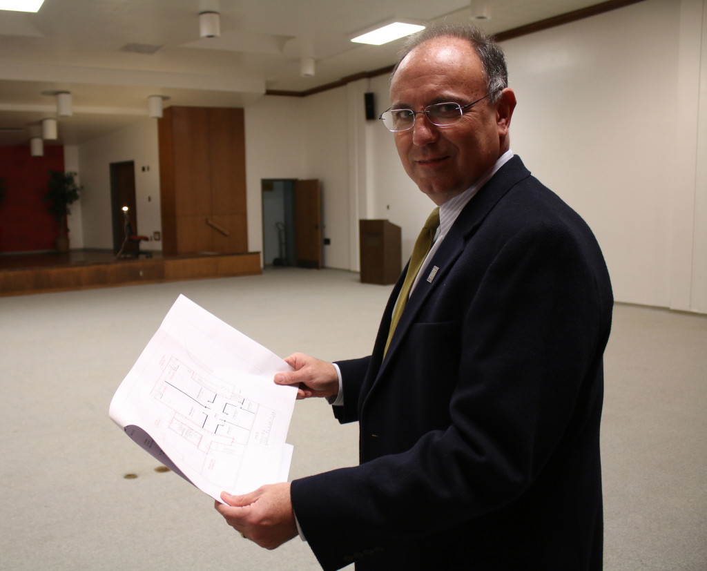 Milligan College President Dr. Bill Greer on the ground floor of Emmanuel Christian Seminary, with plans showing that space's transformation to engineering labs. Photo by Jeff Keeling