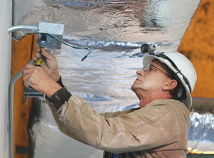 Darryl Cwick of Briscall Electric installs conduit at Northeast State’s teaching site at Johnson City’s Downtown Centre