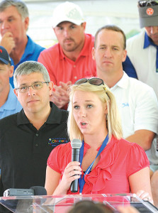 Laura King, mother of NCH patient Maddy King, talks about her daughter’s care as Alan Levine, Jason Witten and Peyton Manning listen. Photo by David Wood