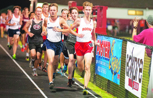 Daniel Boone’s Nick Roth takes the inside lane during a heat at Boone’s HOKA One two-mile invitational Saturday night. Photos by Bart Nave Photography. See photo galleries at: bart.ifp3.com