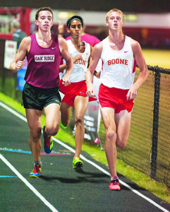 Daniel Boone’s Josh Routh, right, and Ben Varghese pass an Oak Ridge runner at Boone’s two-mile invitational Saturday. Routh won in 9:09 and Varghese was second in 9:34. Photo by Bart Nave