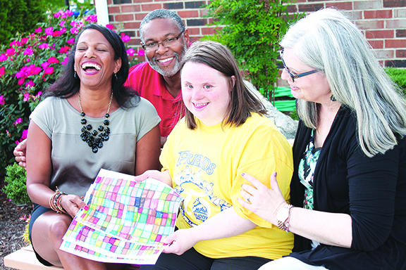 Joanna Torgerson, second from right, with her buddies Regina and Darryl Collins and her mom, Kathy. Photo by Sarah Colson