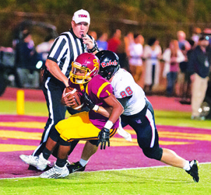 Backup quarterback Jaylan Adams barely avoids a safety. Photos by Bart Nave Photography. See photo galleries at: bart.ifp3.com