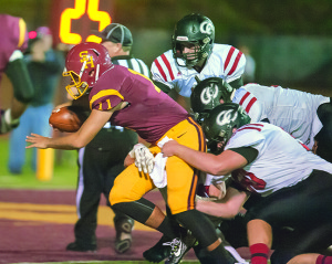 Senior quarterback Justin Bedard bulls into the end zone for one of his two rushing touchdowns. Photos by Bart Nave Photography. See photo galleries at: bart.ifp3.com