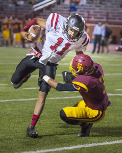 Tyrek Perkins makes a tackle attempt on Alontae Taylor, the standout QB for Coffee County committed to Vanderbilt.