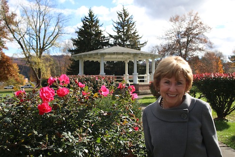 Mountain Home Director Charlene Ehret in front of the Mountain Home gazebo, where she and Steve Adcock wed eight years ago. Photo by Jeff Keeling