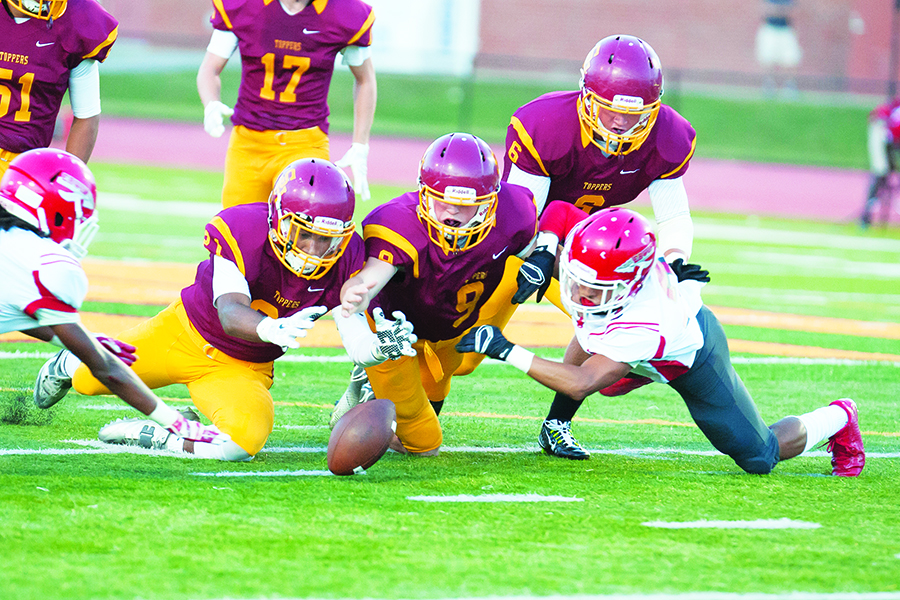 Science Hill defenders swarm toward a loose ball in the team’s homecoming game victory over Erwin (N.C.) Photo by Bart Nave