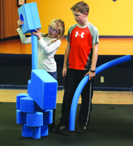 Caroline and Luke Bader enjoy one of Hands On’s newest areas, the Imagination Playground. Photo by Jeff Keeling