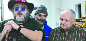Marcus Reeves, left, and Bob Bradley, right, have a good time with their friend, Harvey Charlton at Adult Day Services in Johnson City. Photo by Sarah Colson