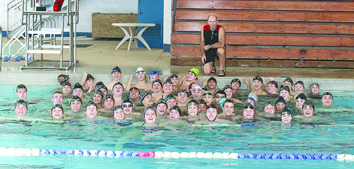 Gerlock, front and center, with the Barracuda Swim Club whose members Gerlock says have been instrumental in her growth as a swimmer. Photos by Jeff Keeling