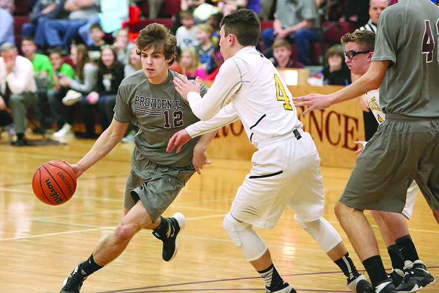 Senior Caleb Backus drives into the lane in the boys’ 63-34 victory over KACHEA. The team heads next to a post-season tournament in Dayton.