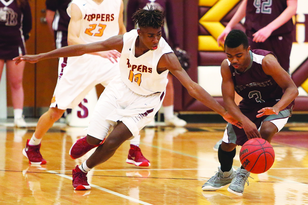 Nate Jackson reaches in for a steal attempt in a game that saw the Toppers force a bushel full of turnovers. Photo by Dakota Hamilton, docophotography.com