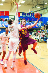 Science Hill senior Chris Linville releases a running left-handed hook. Linville had 15 points against Crockett.