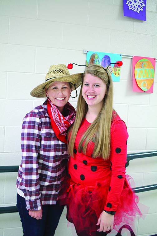 Kindergarten teachers Kelly Bowman, left, as Farmer Brown from ‘Click Clack Moo’ and Anna Hardgrave as Ladybug Girl, from the series of the same name.