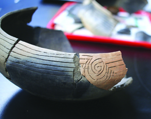 A closeup shows the intricate designs that were stamped and incised into much of the pottery found at Cane Notch. Photos by Jeff Keeling