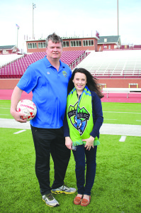 Michael and Elizabeth Balluff, Tri-Cities Otters co-owners, on the team’s home pitch at Science Hill High School’s Kermit Tipton Stadium. Photo by Jeff Keeling