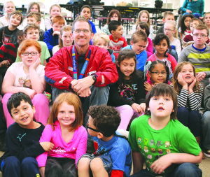 2004 Olympic gold medalist Tim Mack (pole vault) with Fairmont Elementary schoolers. Photo by Jeff Keeling