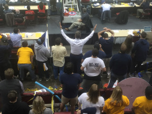 ETSU President Dr. Brian Noland, center, cheering from the student section. Photo by Scott Robertson