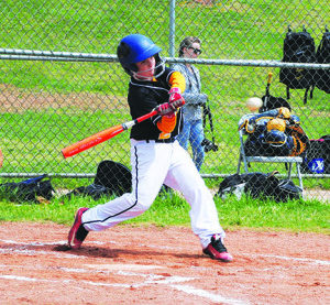 Lightning’s Michael Kelly takes a mighty cut in the team’s season-opening 11-6 loss to Express. Photo by Bill Derby