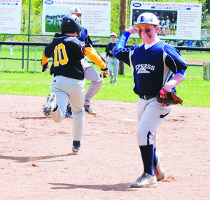 Express second baseman Carter McKenzie opts for the fielder’s choice as Lightning’s Ryan Smith takes second. Photo by Bill Derby