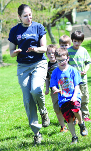 ETSU parks and recreation management major Emily McLeod works with Lucas Hine, front right, and other students.