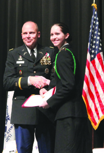 Cadet Hayli Evans, right, received two awards: the award of excellence for maintaining a 3.85 GPA and the Marine Corps League Community Service Award from Colonel Mike Johnson (left). Photos by Sarah Colson