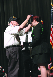 Cadet Genna Boggs received two awards: the award of excellence for maintaining a 3.8 GPA and the Korean War Veterans award, presented by Commander Shelton (left) of the Korean War Veterans Association Chapter 289.