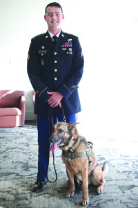 Army Sgt. Joseph Snodgrass with Arabela, a 7-year-old Belgian malinois who is an explosives detection dog working with the 510th Military Police detachment out of Fort Campbell, Ky. Photo by Jeff Keeling