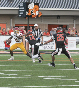 Ahmik Watterson (26), who scored on two long touchdown runs, looks to get around an Elizabethton defender.