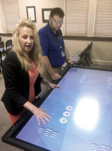Halliburton works with some advanced educational technology at the schools' central office. Photo by Scott Robertson