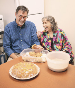 Ellie Chestnut and Dr. Mark Williams enjoy a lighthearted moment fueled by Chestnut’s homemade goodies. Photo by Jeff Keeling
