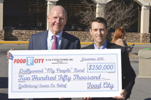 K-VA-T Food Stores President and CEO Steve Smith presents a $250,000 donation to Jeff Conyers, executive director of the Dollywood Foundation. Photos by Scott Robertson