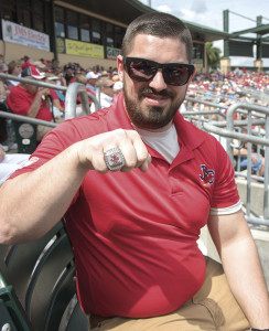 Johnson City Cardinals General Manager Tyler Parsons shows off his Appalachian League Championship that the Cardinals won last season.