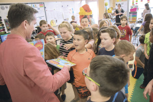 The Lorax Project Director Murphey Johnson passed out copies of The Lorax to second graders at Grandview Elementary.