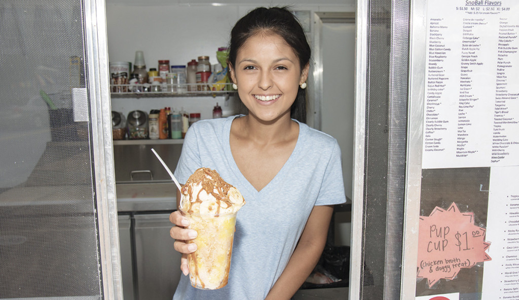 Samantha Lopez, owner of the food truck Sam’s SnoBall Paradise, which is located on South Roan Street, has unique creations like this bananas foster SnoBall for customers to try. Photo by Collin Brooks