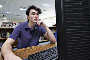 Science Hill senior Billy Bishop spends time filling out college applications on Thursday inside the Science Hill library.