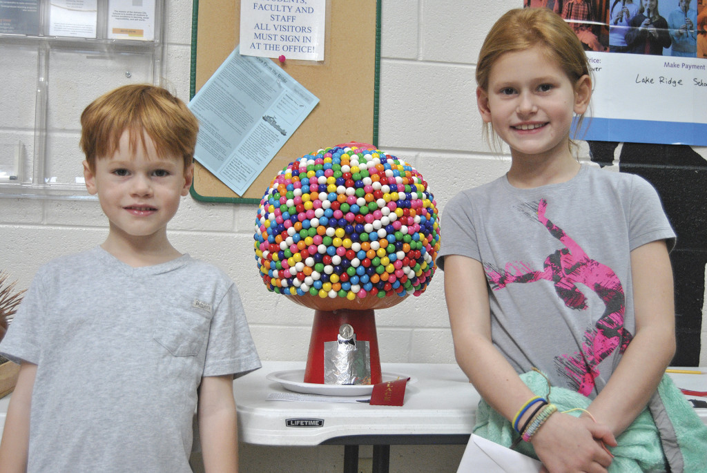 Lydie and Channing Webb with their Gumball Machine pumpkin, which won second place in the Lake Ridge contest.