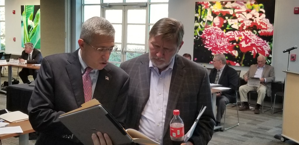 Mountain States CEO Alan Levine confers with Southwest Virginia Health Authority staff member Barry Dennis during an October hearing in Abingdon. Photo by Scott Robertson