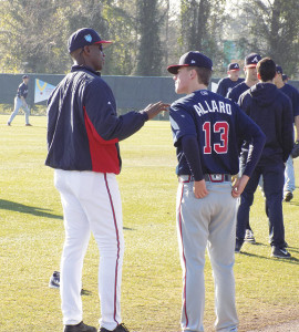 Fred McGriff (left), a former All-Star first baseman for the Atlanta Braves, gives current Braves prospect Kolby Allard some pointers during spring training in Florida. PHOTOS BY BARRY BLAIR